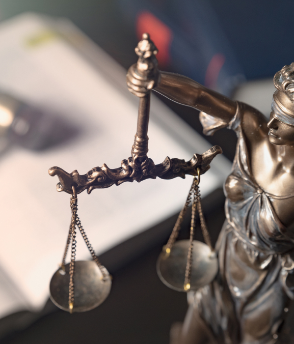 a figurine of a lady justice