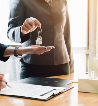 attorney giving house keys to the client